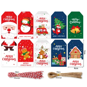 Detailed set of 100 Christmas kraft gift tags with twine showing 7x4cm size and various patterns