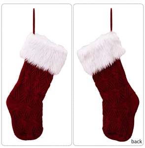 Detailed front and back views of a dark red cable knit Christmas stocking with white faux fur