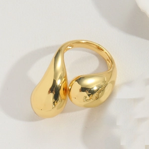 Detailed side view of a gold adjustable ring featuring a unique molten liquid drop design