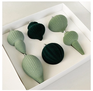 Detail of 6-piece flocking Christmas ornaments in deep and bean green within a gift box