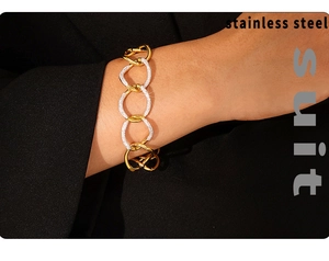 Close-up of punk style thick chunky chain bracelet with inlaid rhinestones and stainless steel