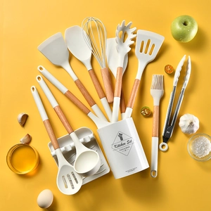 Detail view of 11pcs white silicone cooking utensil set with natural wooden handles