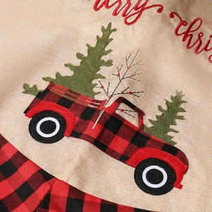Classic Christmas tree skirt featuring a red buffalo plaid truck and merry christmas embroidery