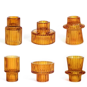 Detailed grid showing amber ribbed glass candle holders with elegant vertical textures