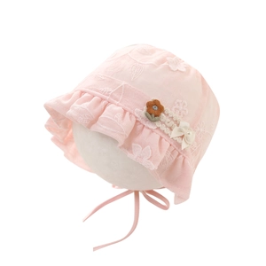 Pink lace baby princess hat with floral embroidery and side bow on white background