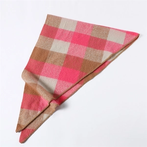 Detailed view of pink and brown checkered faux cashmere triangle scarf with hemmed edges