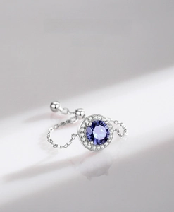 Macro shot of S925 sterling silver chain ring with purple stone and micro-pave crystals