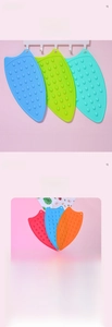 Close-up of heat-resistant silicone iron rest pads with non-slip texture and vibrant colors