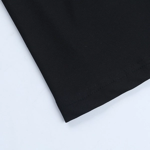 Close-up of black shimmering evening gown hem with professional double-stitched seams