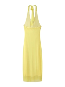 Detailed view of the bright yellow halter neck long dress with clean cut and summer style