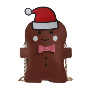 Gingerbread man crossbody bag with Christmas hat and gold chain strap on white background