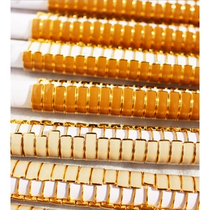 Stack of colorful enamel stretch bracelets with gold-plated metal trim in boho style