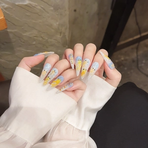 Blue cat-eye press-on nails with hand-painted goldfish and artistic ocean motifs