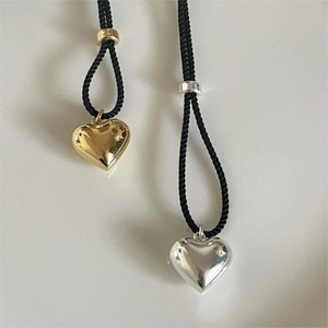Minimalist 925 sterling silver puffed heart pendant in gold and silver finish on black cord