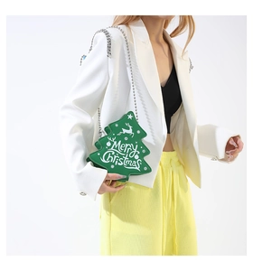 Crossbody Christmas tree bag with Merry Christmas text shown on model outfit