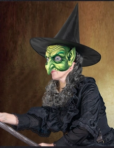 Detail of green witch mask with long nose and black pointed hat for Halloween cosplay