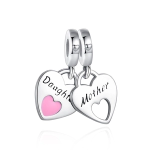 Detailed macro of silver Mother and Daughter heart charms with pink enamel for bracelets