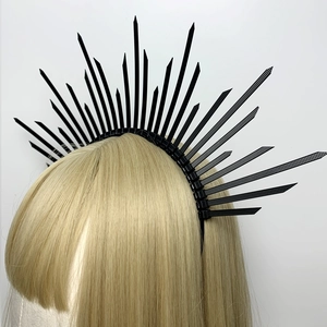 Detailed close-up of a black halo headband featuring a radiant sunburst zip tie design