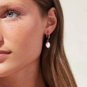 Elegant French vintage gold hoop earrings featuring a white freshwater pearl pendant
