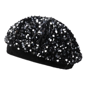 Close-up of black velvet beret featuring shimmering sequins and elegant felt texture