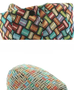 Detail of the colorful plaid woven texture and black metal buckle on the retro beret cap
