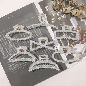 Detailed seven-piece set of pearlescent resin hair claws in various geometric shapes