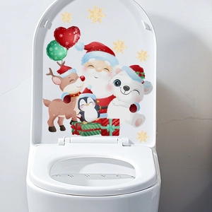 Detail of Christmas toilet lid stickers featuring Santa Claus, reindeer, and snowflakes