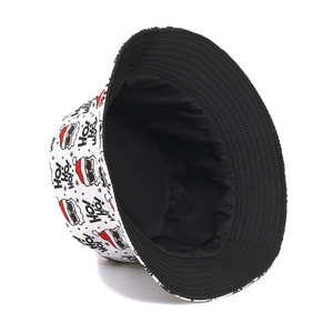 Reversible Christmas bucket hat featuring Santa Claus print and black interior lining