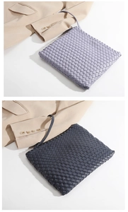 Detailed view of handmade woven leather texture on light purple and navy clutch bags