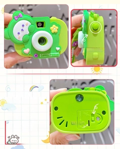 Detail view of green bear projector camera keychain with lovelybear logo and side buttons