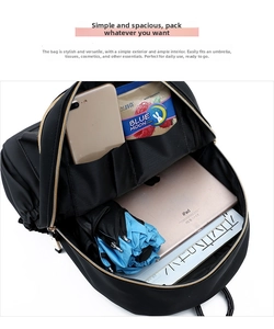 Top view of large black oxford backpack showing organized inner storage for tablet and essentials