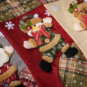 Christmas snowman stockings in red and green plaid burlap fabric for holiday decoration