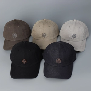 Close-up of five colorful baseball caps with embroidered SINUOYA 1985 mountain logos