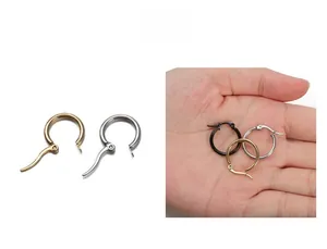 Detailed close-up of stainless steel hoop earrings with clicker closure in gold, silver, and black