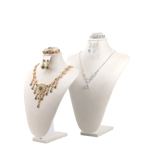 Luxurious velvet jewelry bust displays with vintage gold and elegant silver necklace sets