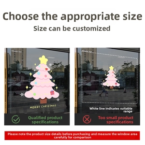 Size comparison detail showing pink Christmas tree window sticker with festive decorations