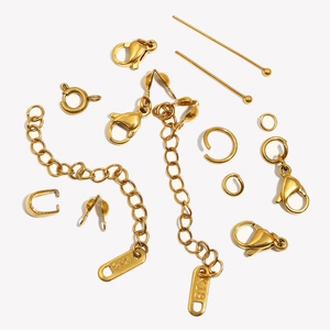 Macro detail of 18K gold plated lobster clasps and jump rings set for DIY jewelry making