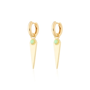 Detail of gold geometric triangle drop earrings with white opal stone inlay