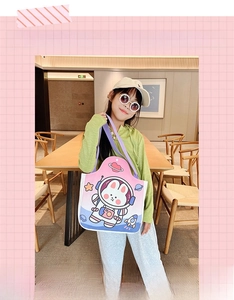 Canvas tote bag with bunny astronaut print and purple straps shown on a 140cm tall model