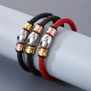 Detailed view of woven leather bracelets in black, brown and red with metallic magnetic clasps