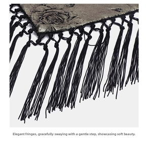 Detail of fabric waist chain with bronze rose print and black fringe tassels