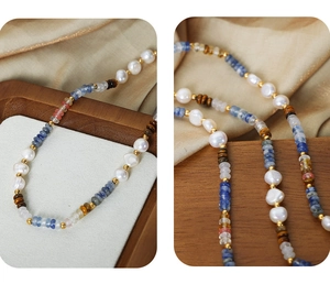 Detail of bohemian handmade necklace with freshwater pearls and blue gemstone beads