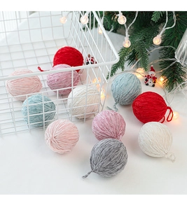 Detail of colorful chenille wool felt balls in a decorative festive setting for DIY crafts