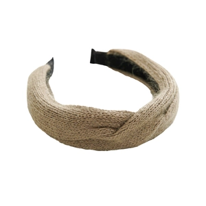 Classic camel plush knitted twist headband for women featuring warm woven texture