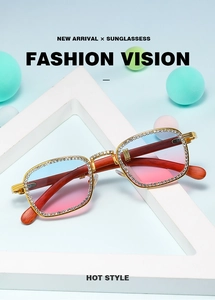 Detail of square frame sunglasses with rhinestone accents and wood grain temples
