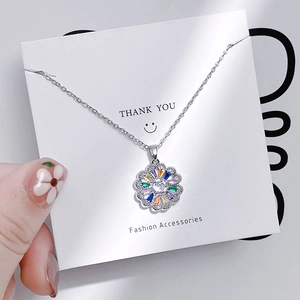 Silver tulip necklace with colorful zircon pendant on a fashion accessories card