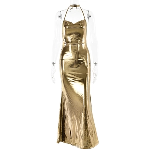 Detailed view of backless gold evening dress with metallic sheen and halter neckline
