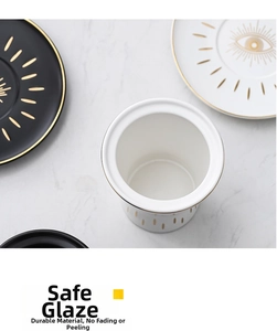 Detail of Turkish Evil Eye ceramic mugs and plates with gold accents on marble background