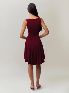Detail of burgundy sleeveless dress back showing slimming fit and elegant drape texture