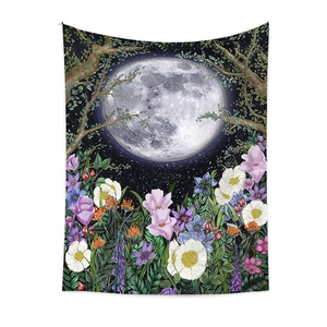 Detail of bohemian moon phase tapestry with starry night sky and blooming floral garden